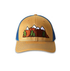 Trucker hat with a mid profile. Front bill and panel is khaki cotton fabric. A snow capped mountain range and trees is embroidered on the front. The back panel is true blue made of mesh with a snapback closure.